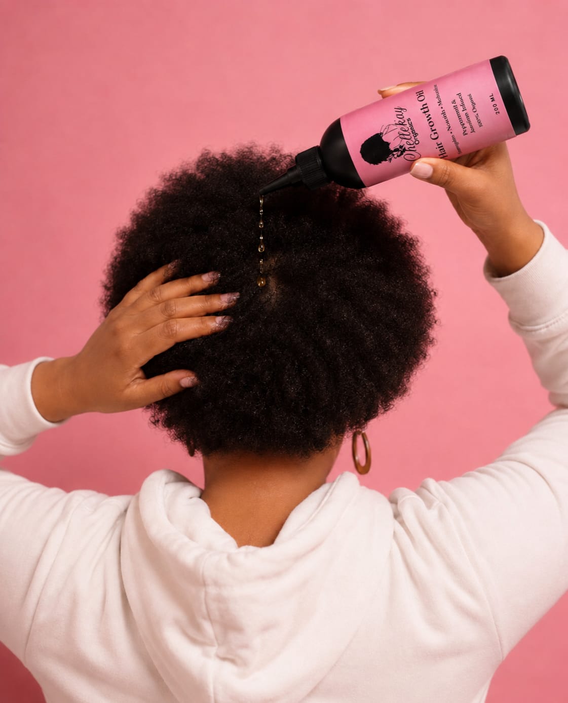 Hair Growth Oil being applied to the scalp